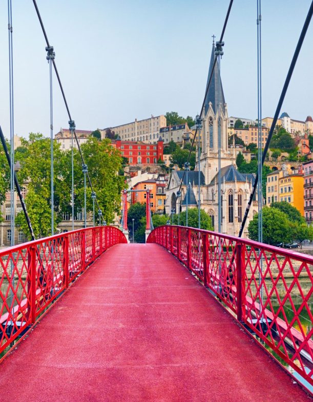 Panoramic view of Lyon at sunrise Panoramic view of Lyon with Saint Georges footbridge over Saone river at sunrise, France